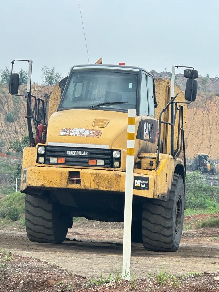 K NDU Caterpillar articulated dump truck working on an open cast mine